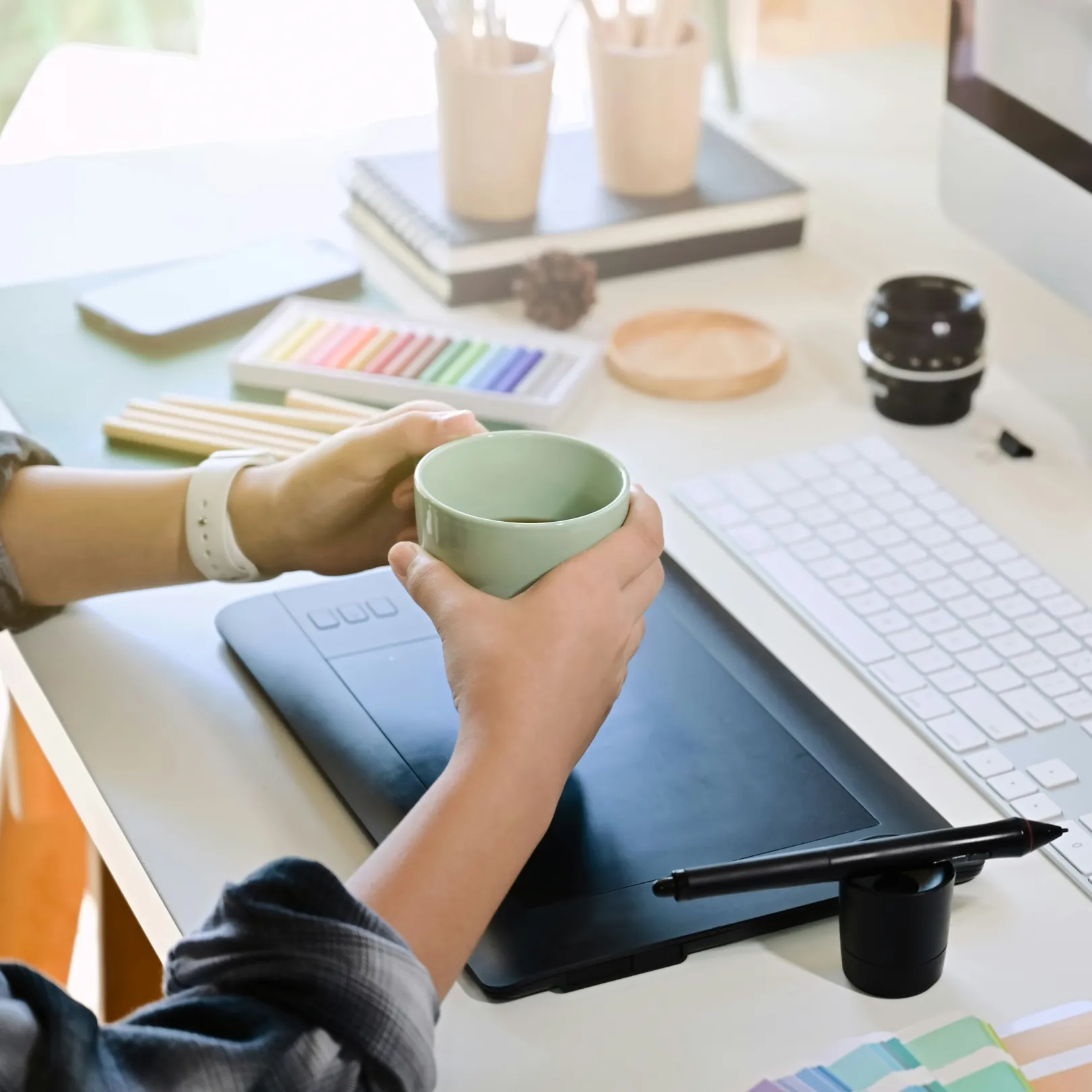 Picture of a designer's desk with a drawing tablet